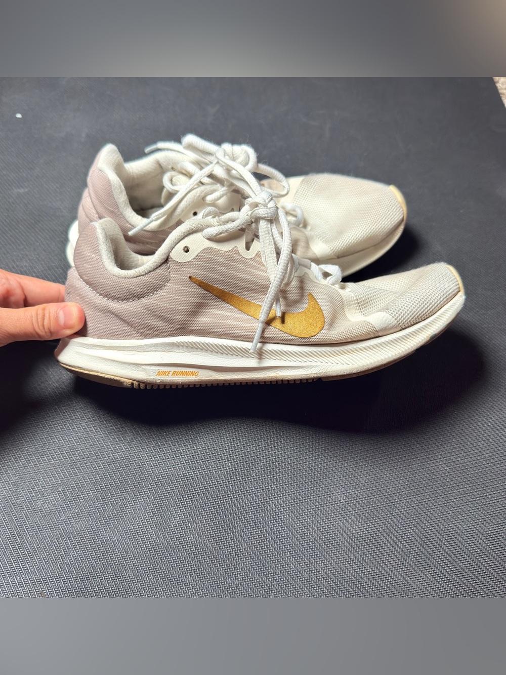 Nike Women's Sneakers in Light Beige with Gold Swoosh